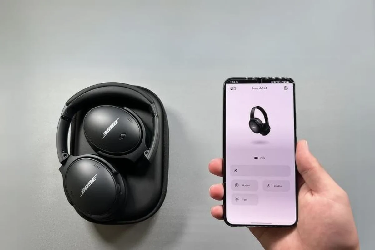 Bose headphones connecting to a laptop with Bluetooth and cable options