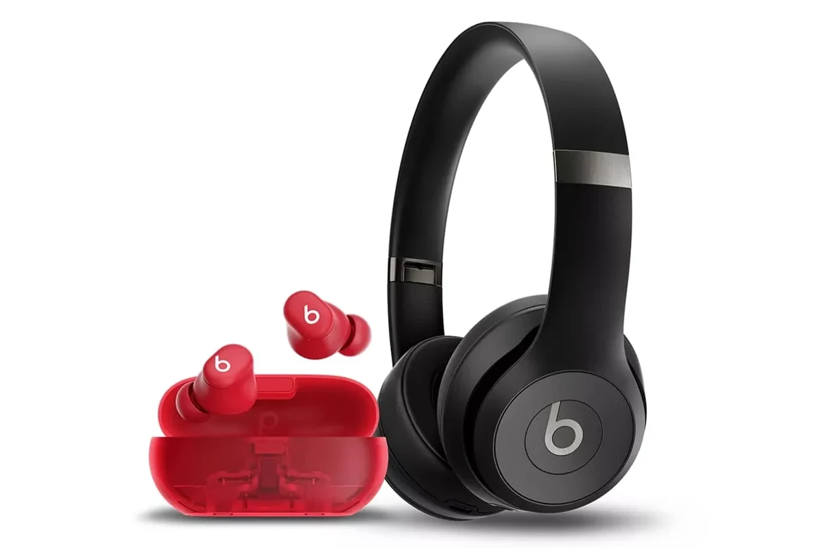 Beats wireless headphones on a table with a smartphone showing location tracking