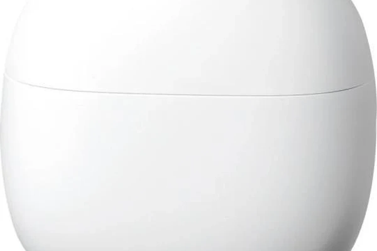 Wireless gaming headphones connected to a PS5 console with a USB dongle