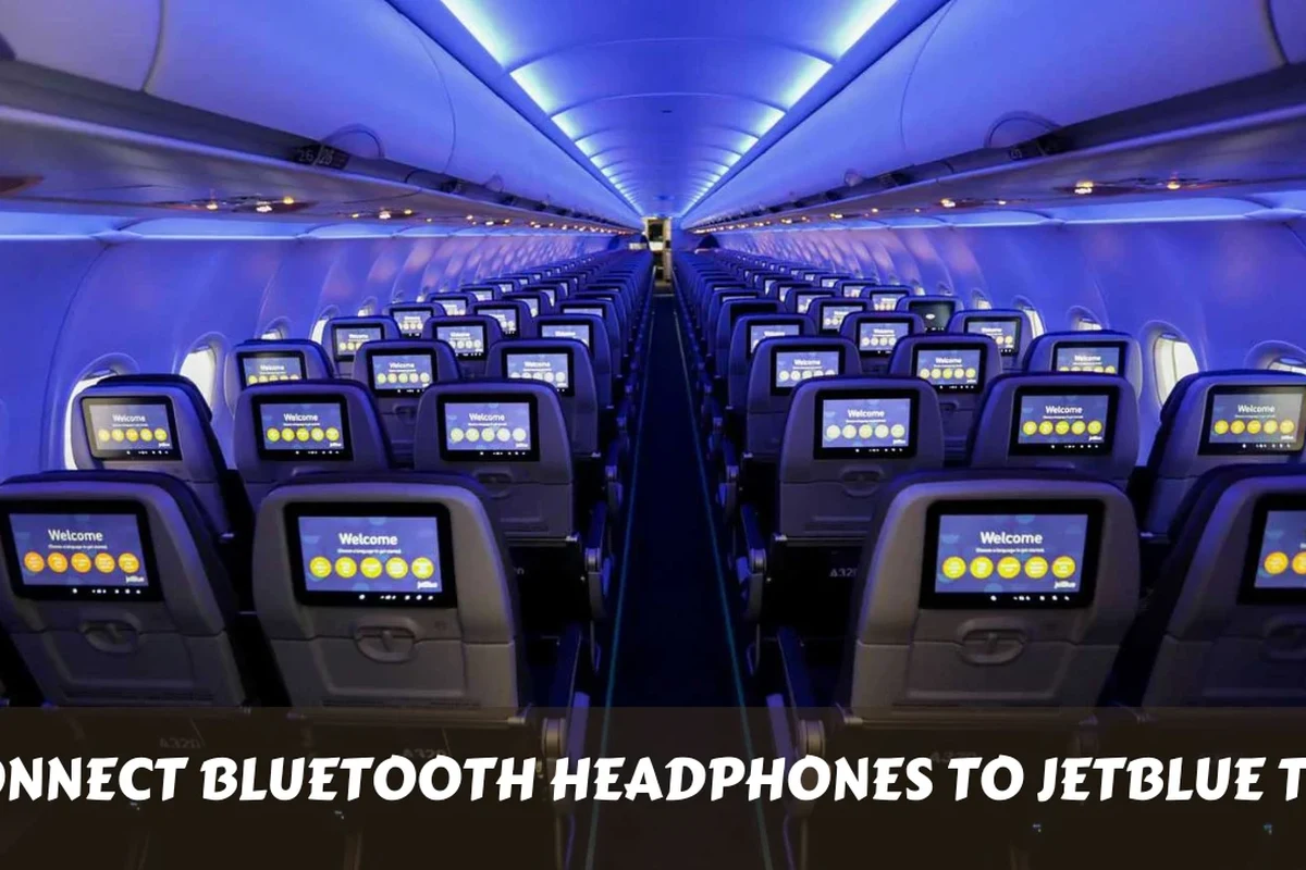 Traveler using Bluetooth headphones with a JetBlue seatback TV on an airplane