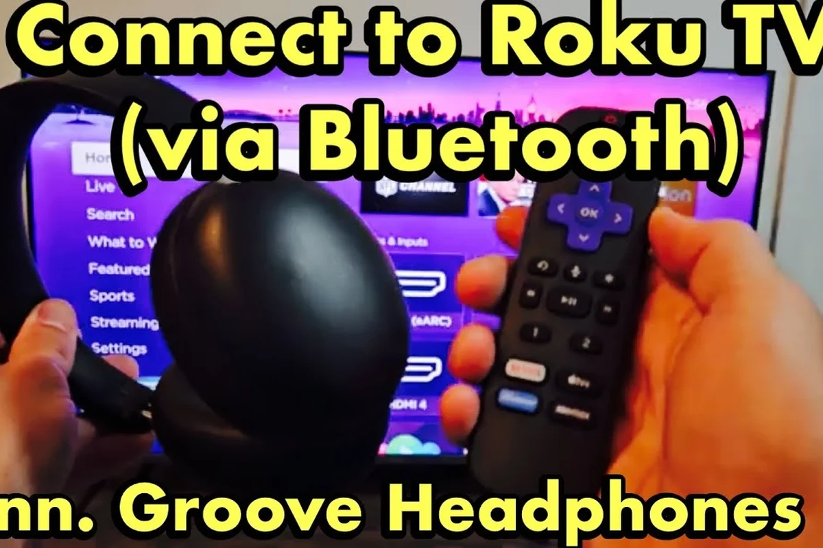 Bluetooth headphones connected to a Roku TV using a wireless transmitter