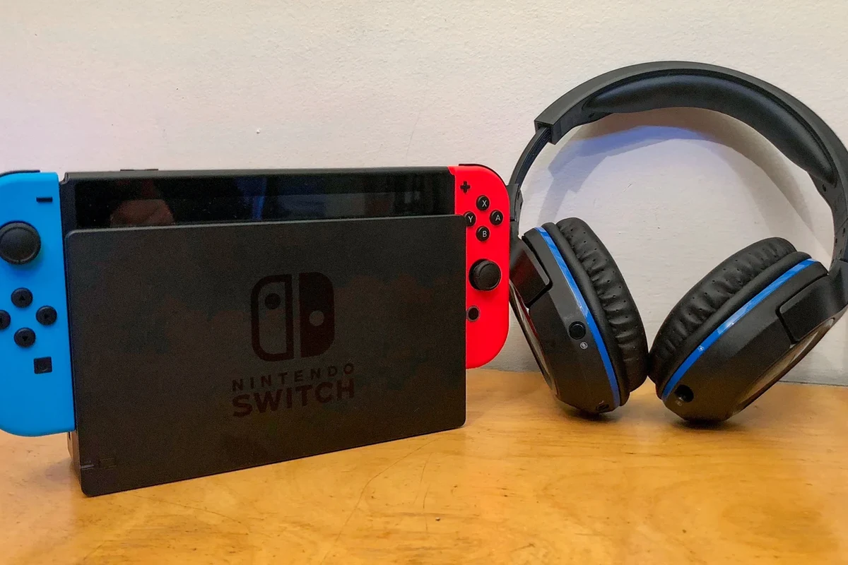 Nintendo Switch with wired and wireless headphones connected for handheld and TV gaming