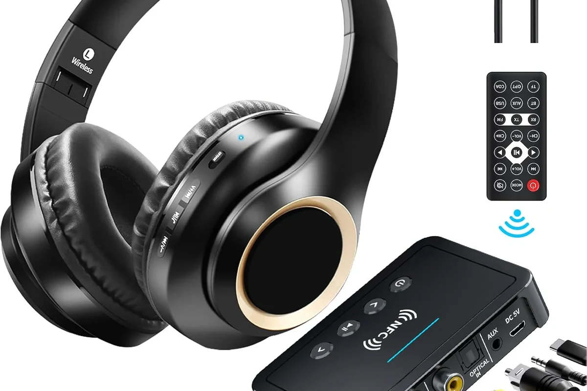 Person connecting wireless headphones to a TV for private listening in a living room