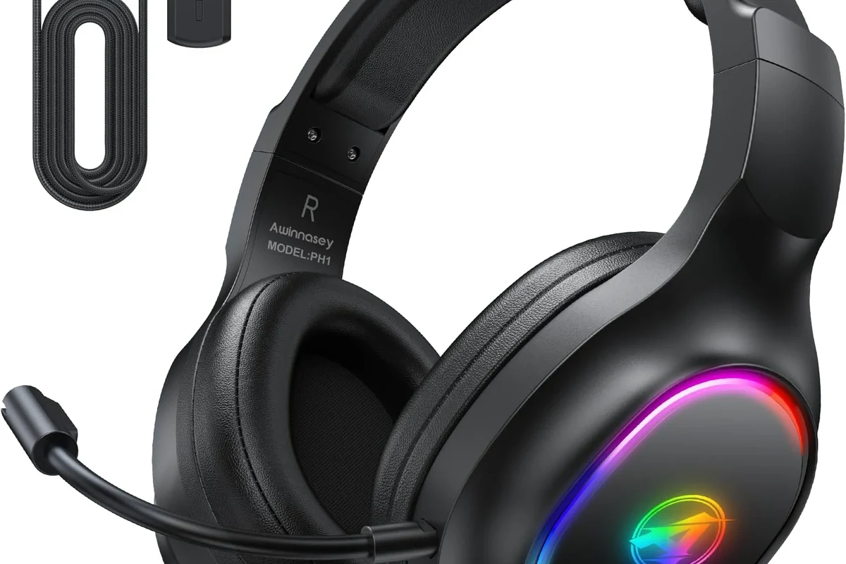 Bluetooth headphones connected to a PS5 console with a wireless adapter and gaming setup