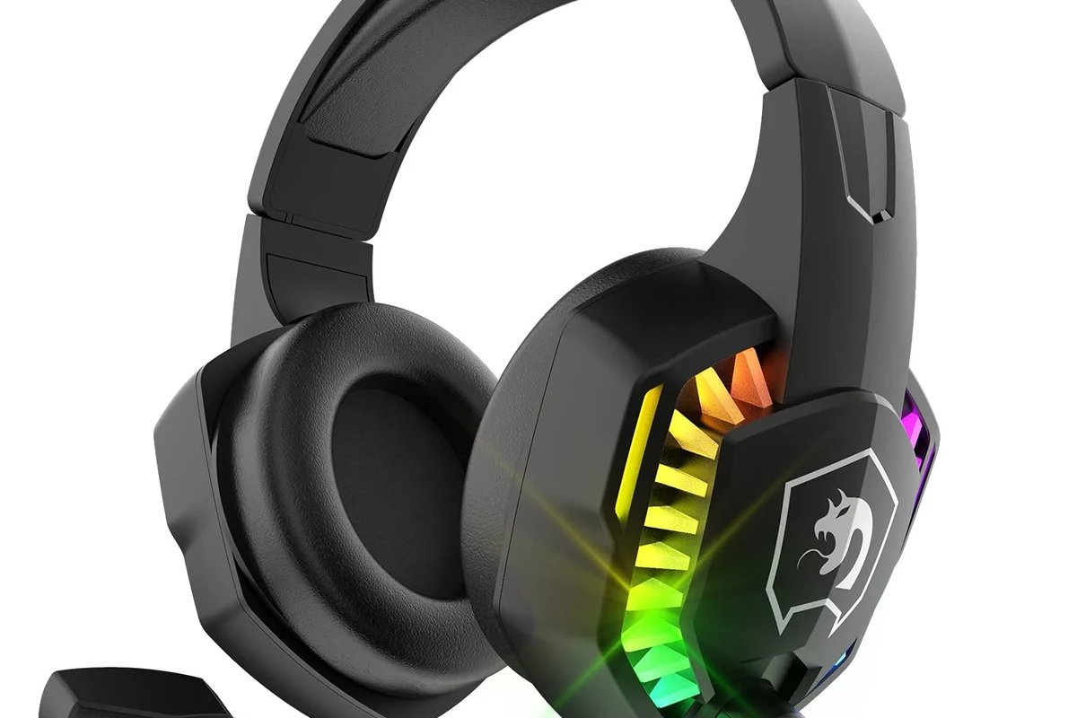 Beats headphones connected to a PS5 controller with gaming setup on desk