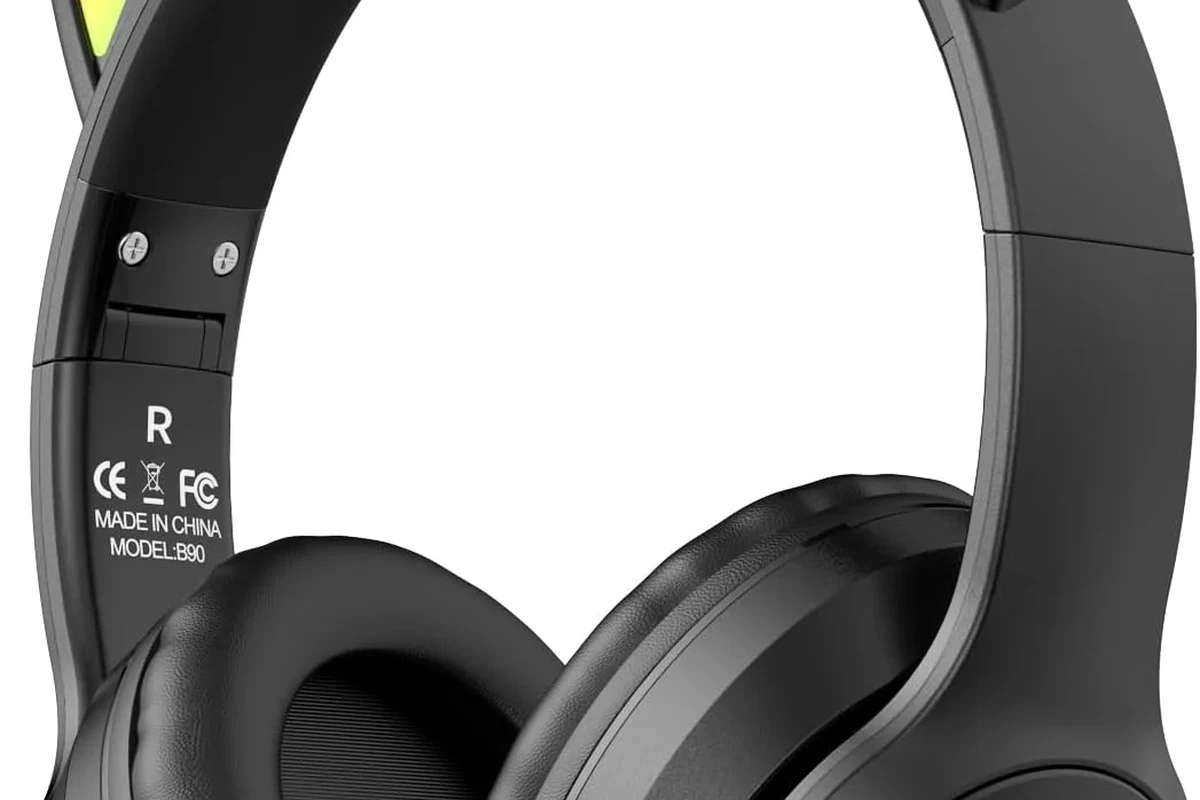 PS5 DualSense controller with wired headphones plugged into the 3.5mm audio jack