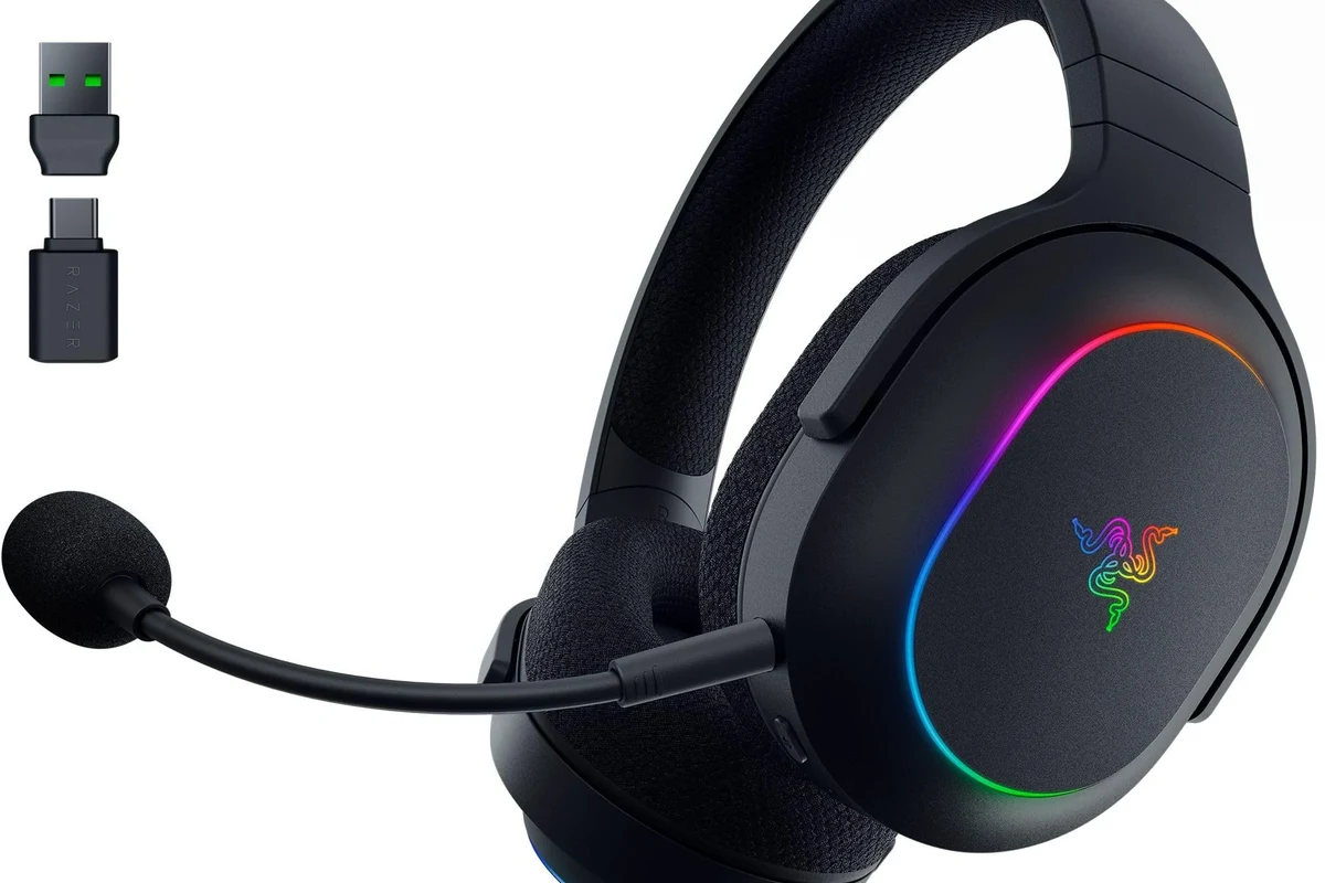 Gaming setup showing Bluetooth headphones connected to a PS5 through a wireless adapter