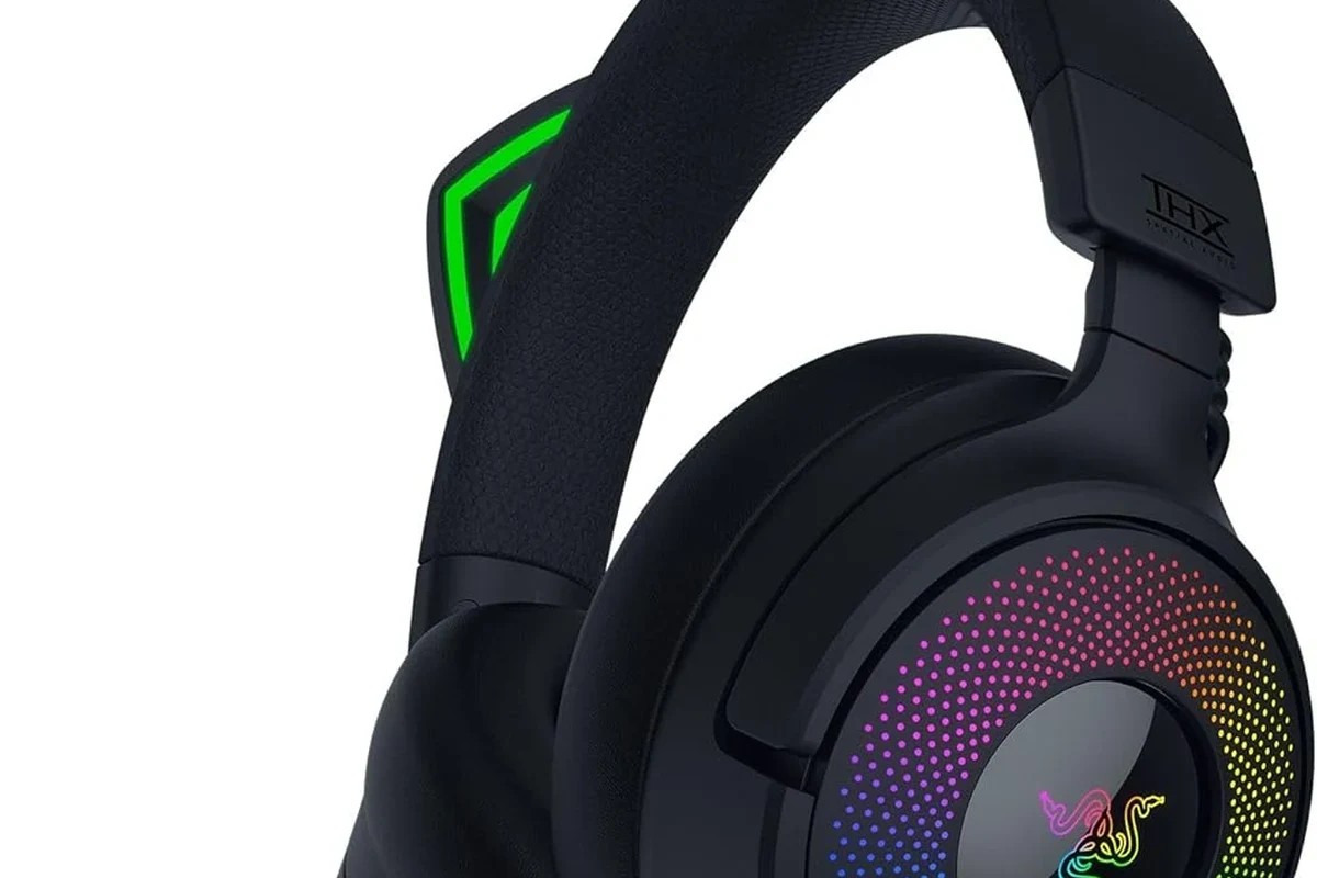 Beats headphones connected to a PS5 console with a Bluetooth adapter