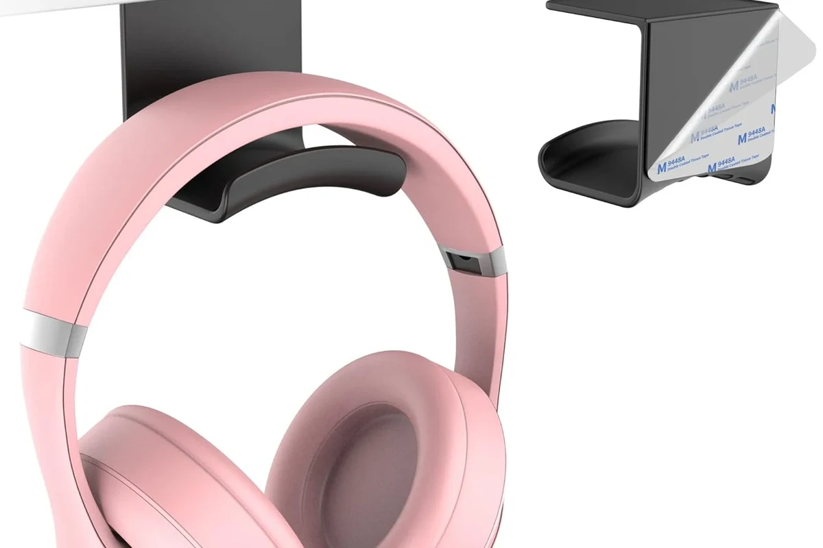 Person connecting wireless headphones to a TV for private listening
