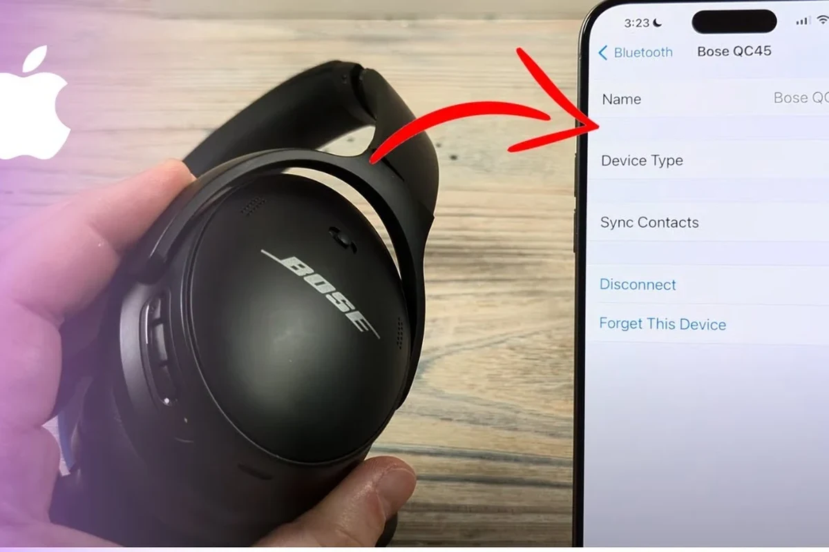 Bose headphones pairing with iPhone Bluetooth settings on a clean desk