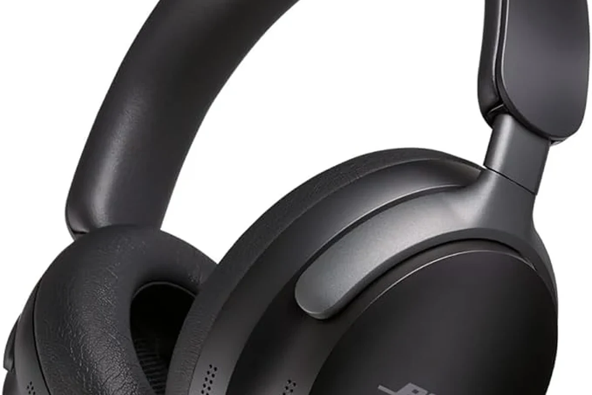 Person checking Bose headphone model details on ear cup label and phone Bluetooth settings