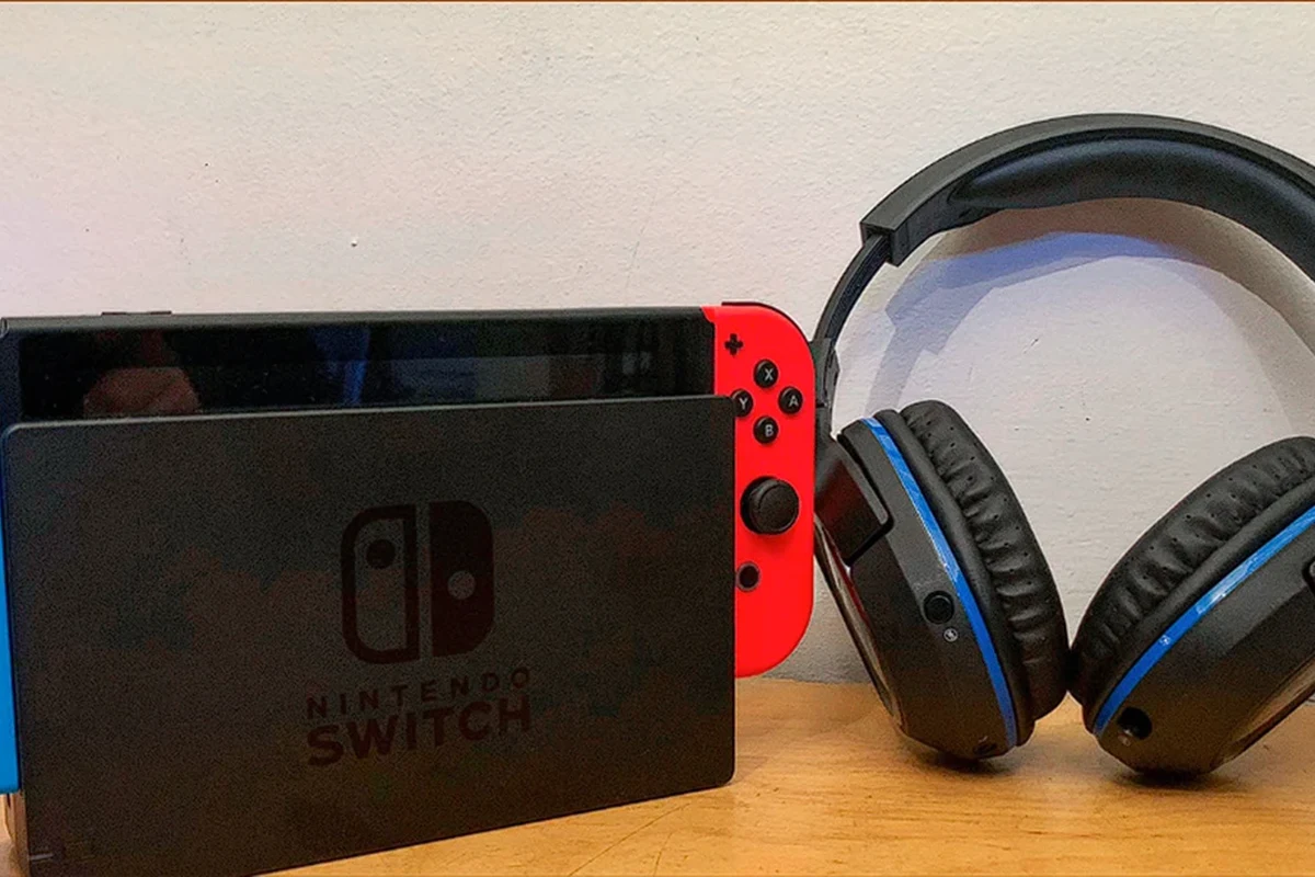 Nintendo Switch paired with Bluetooth headphones for handheld gaming