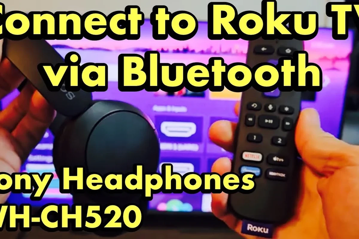 Person pairing Bluetooth headphones to a Roku TV for private listening in a living room