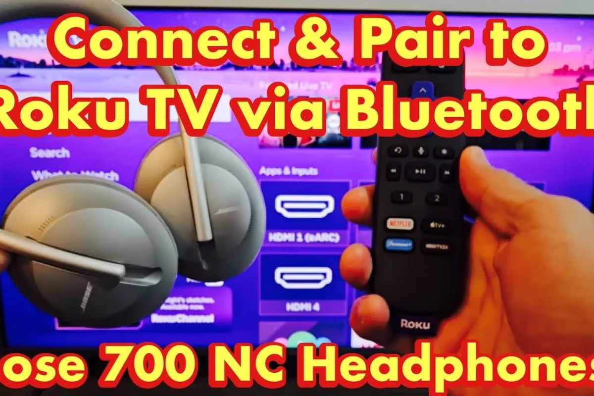 Person pairing wireless headphones to a Roku TV in a living room