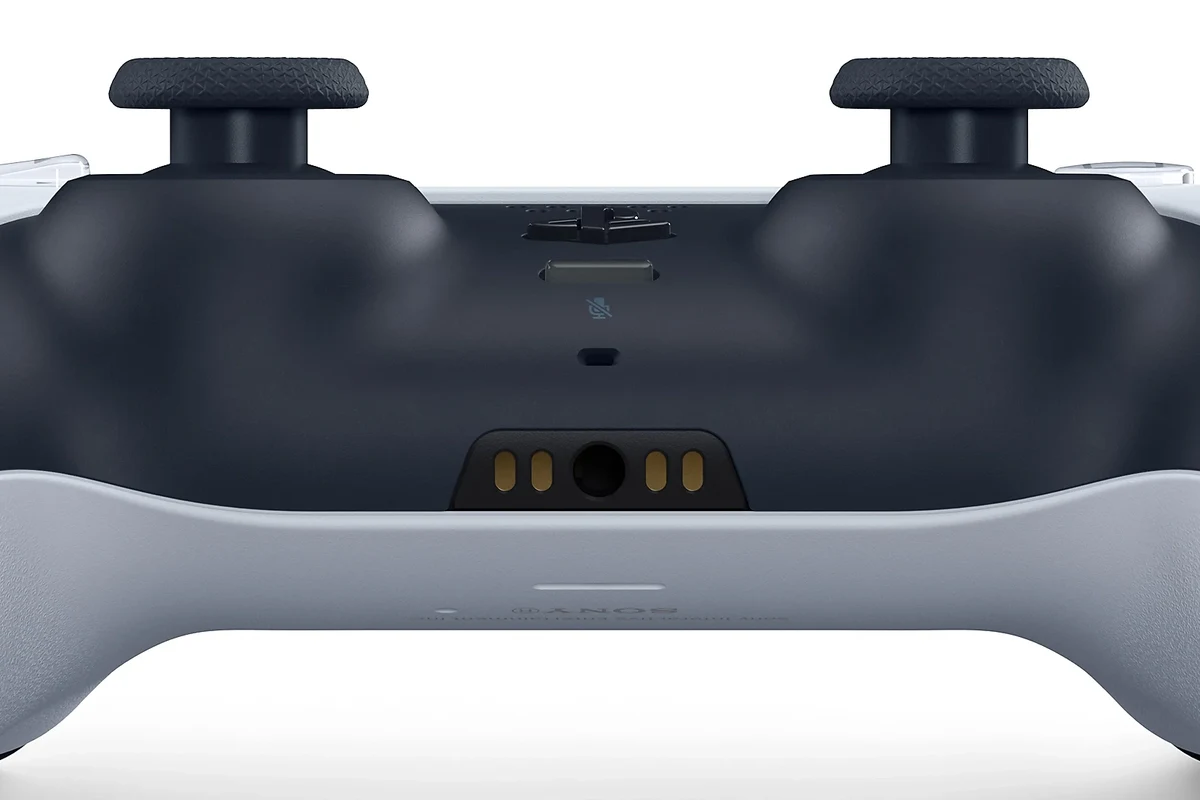 PS5 DualSense controller with wired headphones plugged into the 3.5mm audio jack
