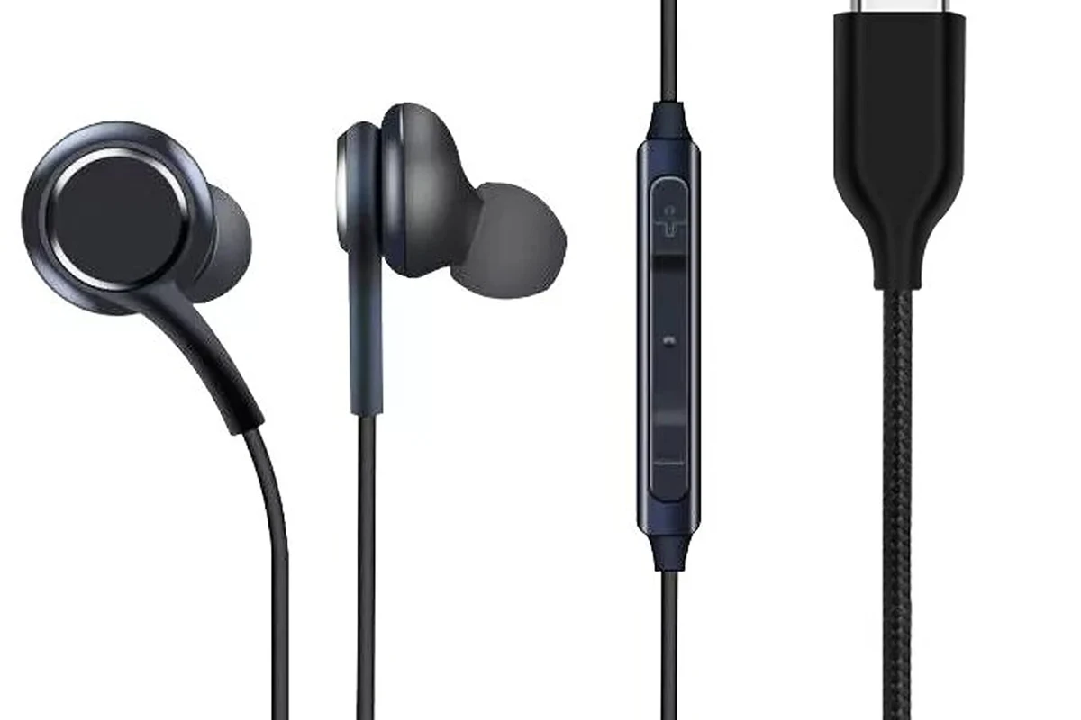 Samsung Galaxy S22 with wireless earbuds and USB-C audio accessories on a clean desk