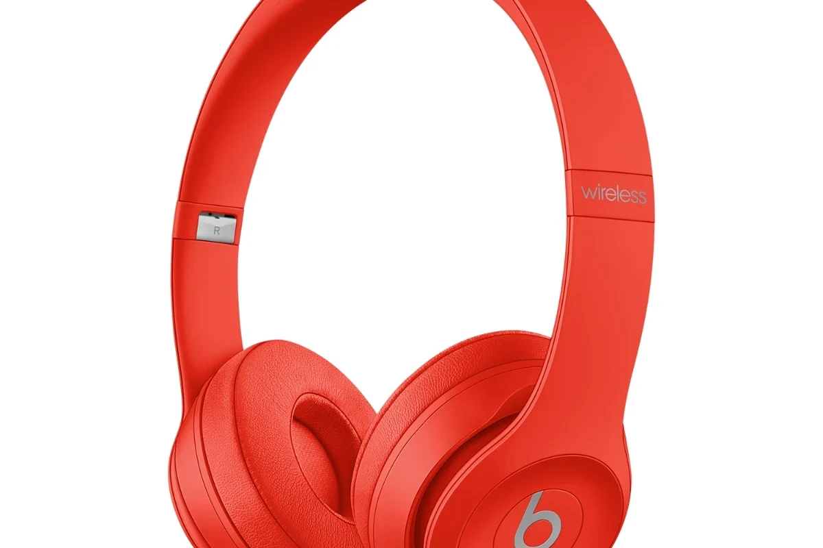 Beats headphones for sale with box, charging cable, and listing setup on a clean desk