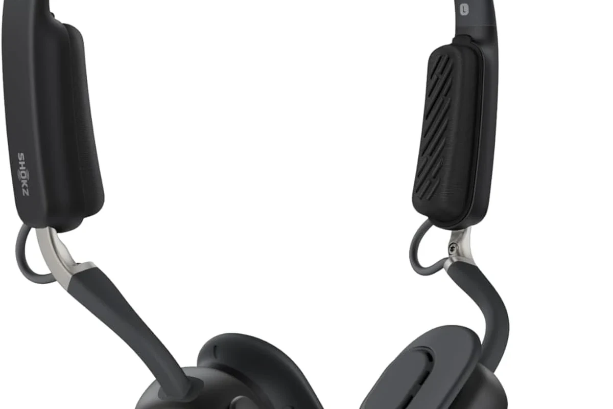Shokz bone conduction headphones resting on cheekbones during outdoor running
