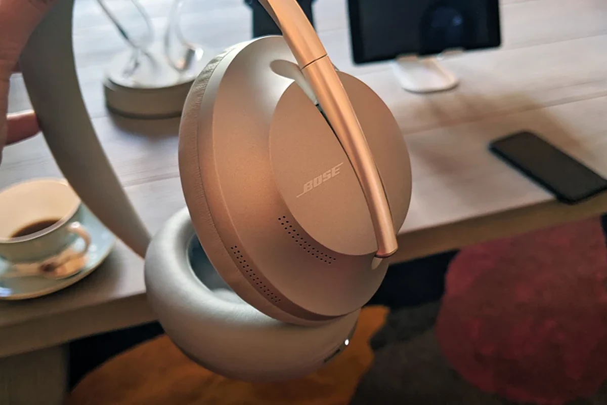 Person checking Bose headphones model name on earcup and in a phone app