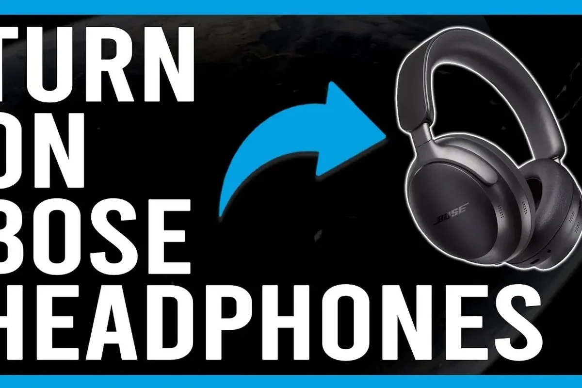 Person turning on Bose wireless headphones using the power button