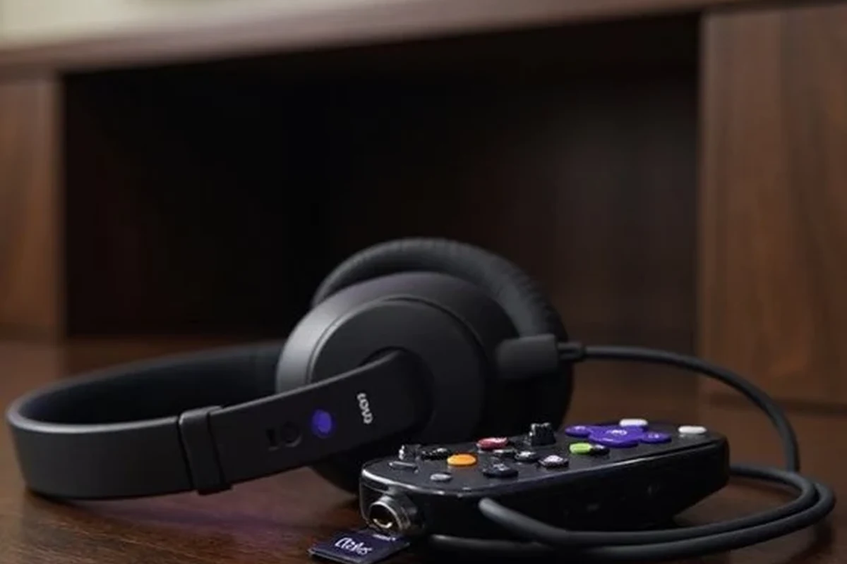 Person using wireless headphones with a smart TV in a living room