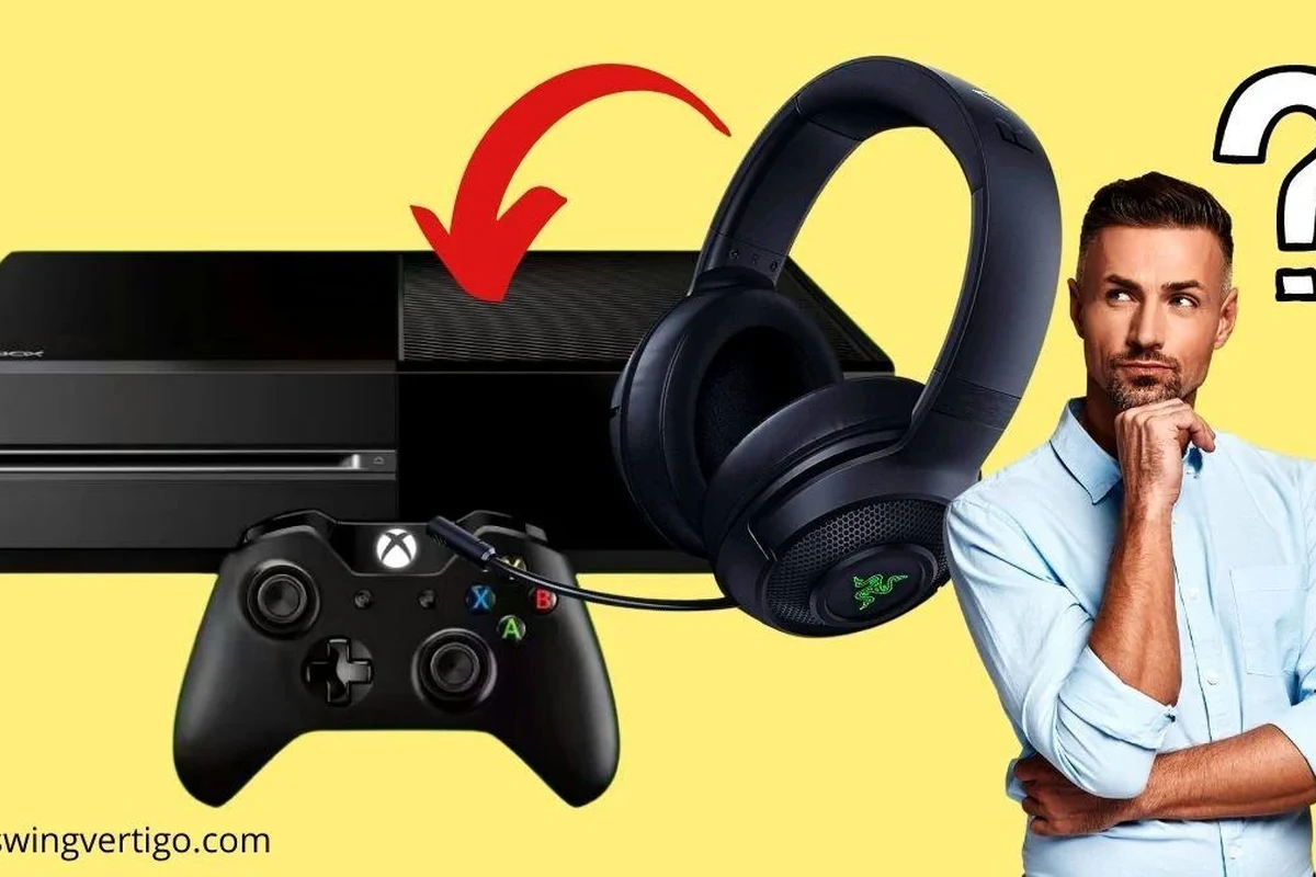 Xbox One console with USB headphones, controller, and audio setup on a gaming desk