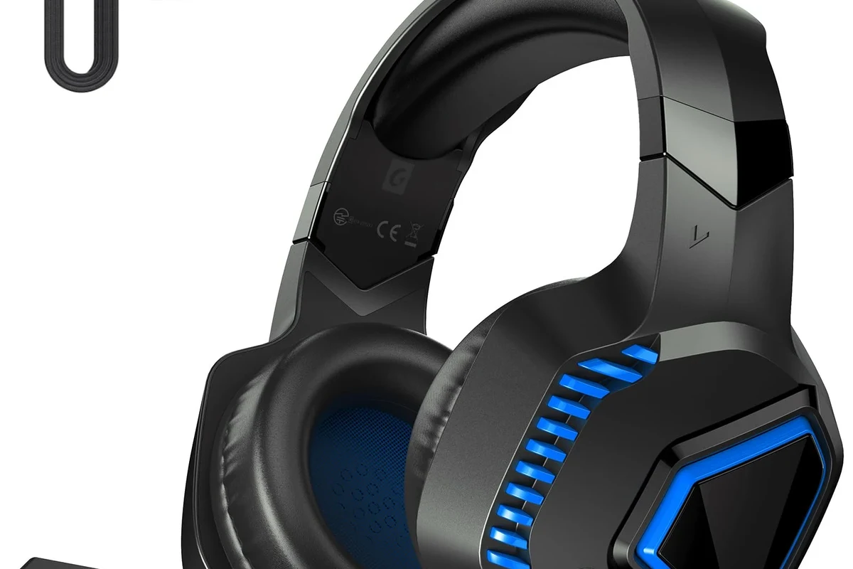 Wireless gaming headphones connected to a PS5 console beside a DualSense controller