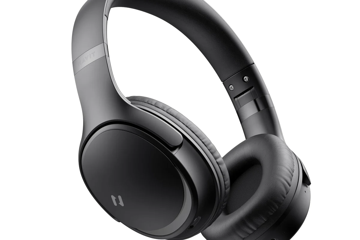 Person pairing Bluetooth headphones to Apple TV for private movie listening