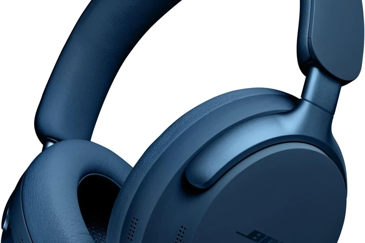 Person pairing Bluetooth headphones with a Samsung TV in a living room