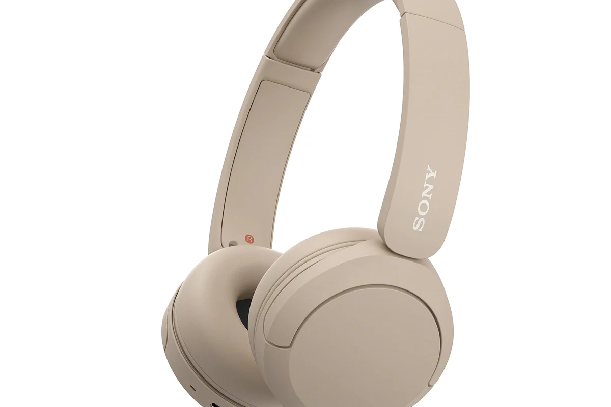 Nintendo Switch paired with wireless Bluetooth headphones for handheld gaming