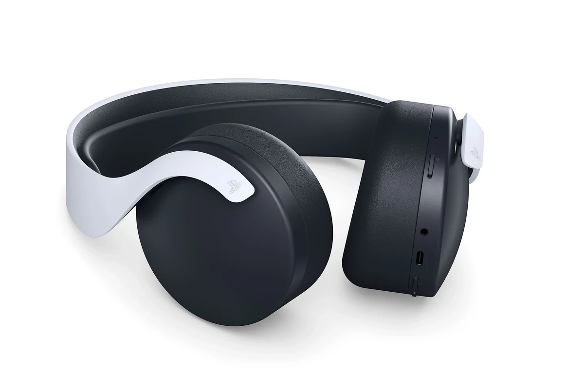 Wireless gaming headset connected to a PS5 console beside a TV and controller