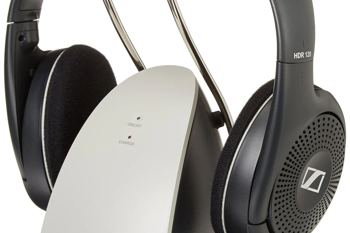 Wireless headphones connected to a TV for private listening in a living room