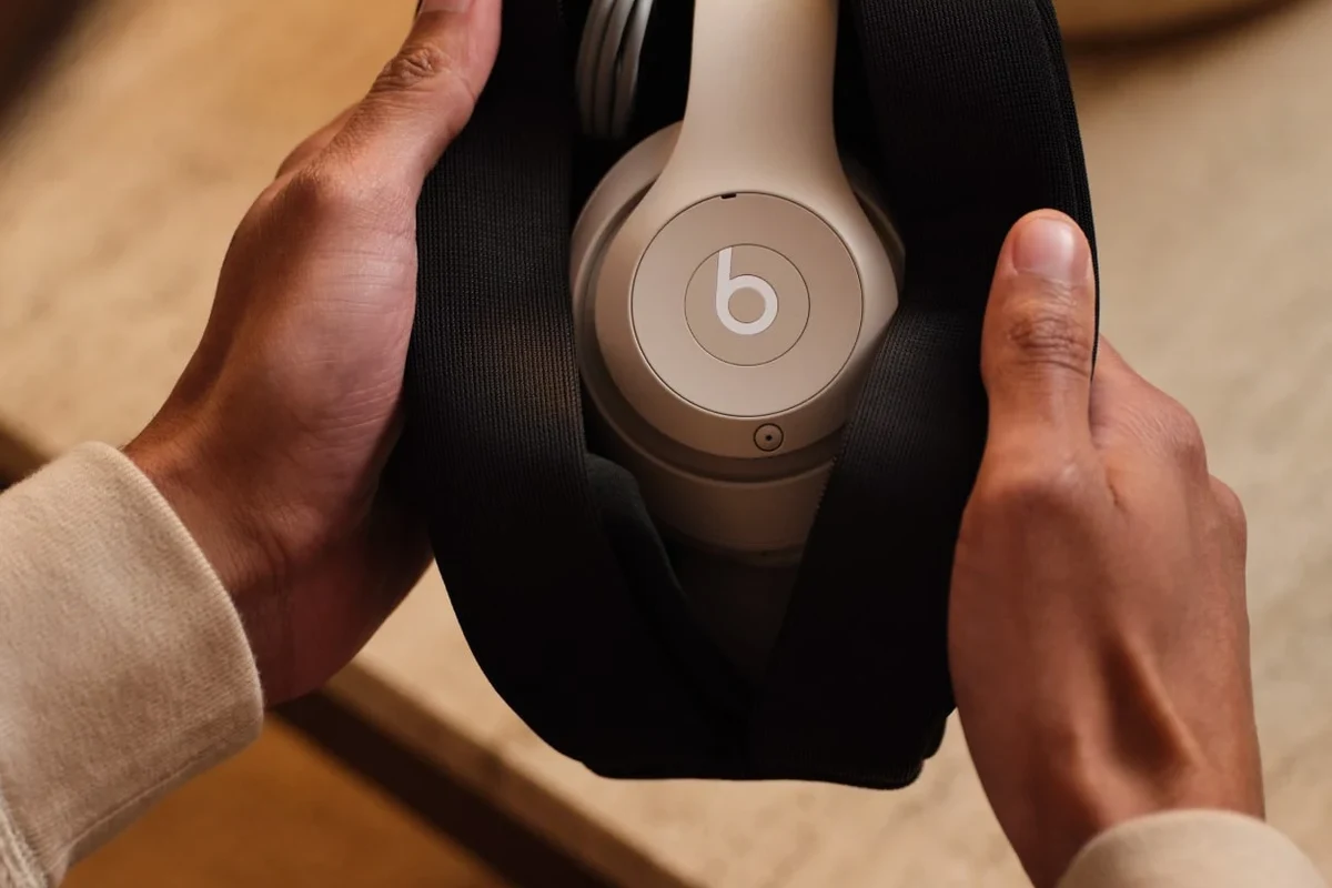 Beats headphones paired with a phone and laptop showing Bluetooth setup and troubleshooting