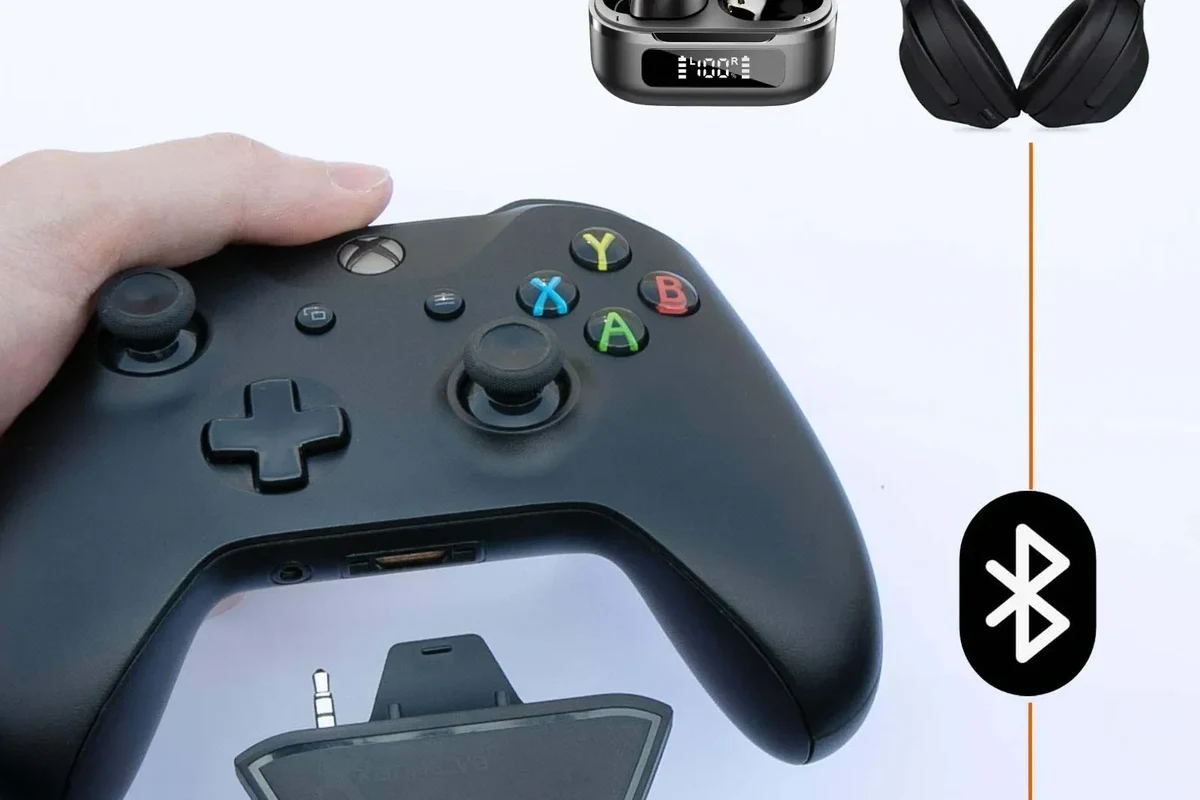 Xbox console with wireless headphones and controller on a gaming desk