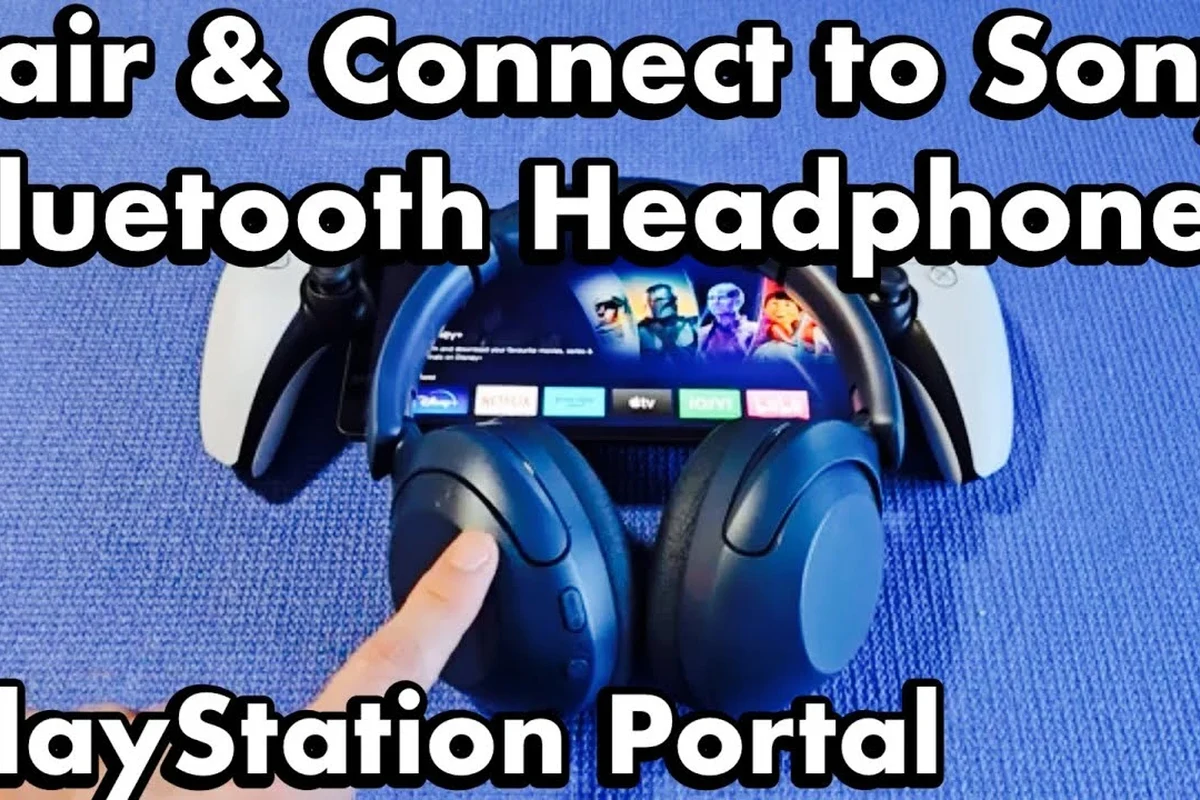 PlayStation Portal with wireless gaming headset and Bluetooth headphones on a desk