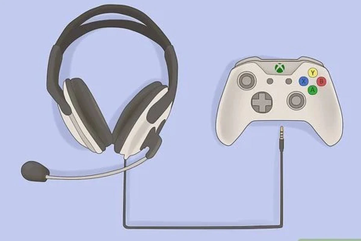 Xbox controller with wired headphones connected beside a gaming console setup