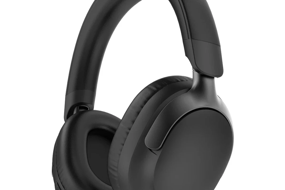 Wireless headphones connected to a Nintendo Switch handheld console on a gaming desk
