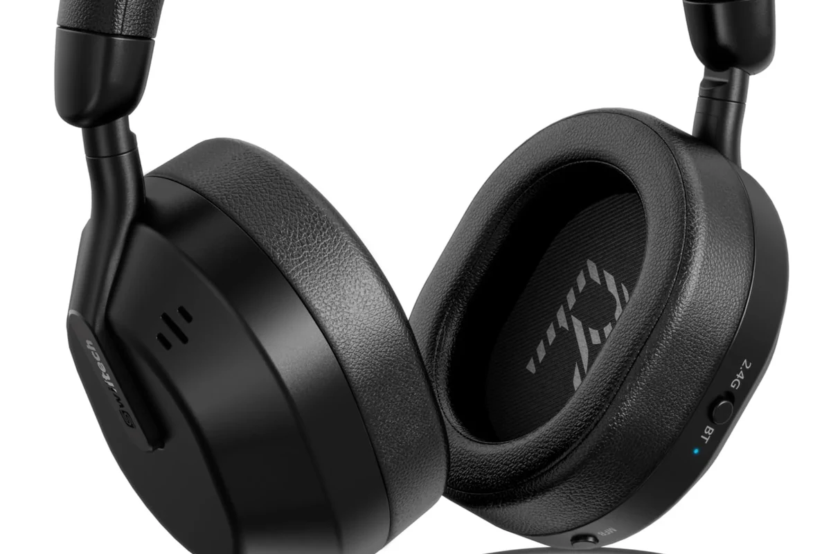 Person watching TV with wireless Bluetooth headphones in a quiet living room