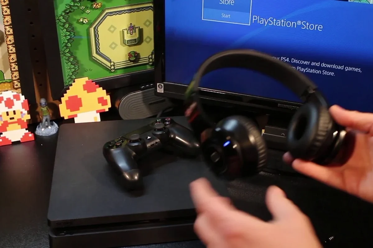 Gaming headset and Bluetooth transmitter connected to a PS4 console for wireless audio