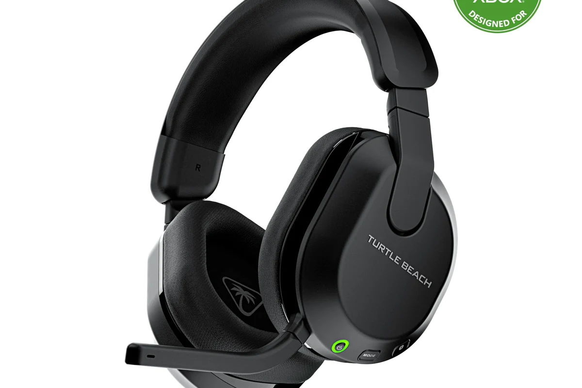 Xbox Series S console with gaming headphones and wireless audio setup on a living room desk
