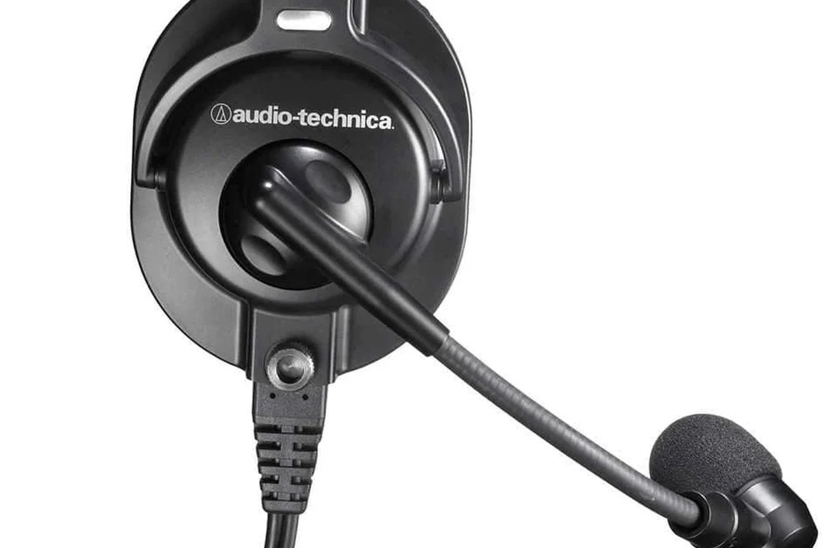 Wireless and wired headset PC microphone options on a clean desktop setup