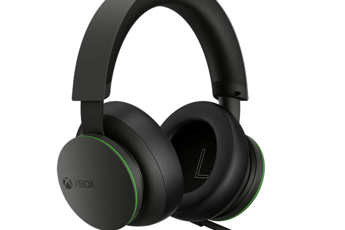 Xbox compatible gaming headset with mic and controller on a clean desk